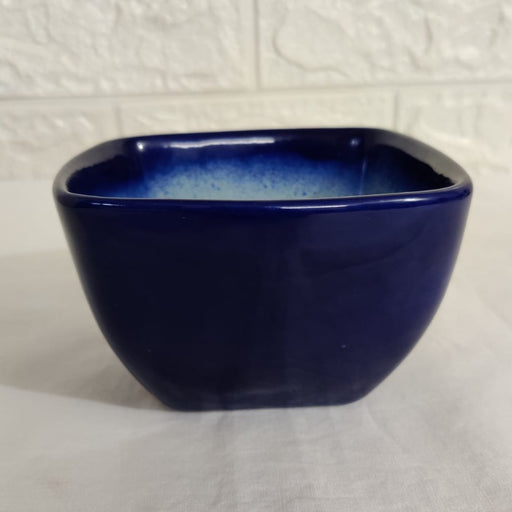 Square ceramic pot with vibrant blue color