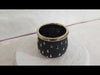 Black and gold ceramic pot for enhancing interior ambiance
