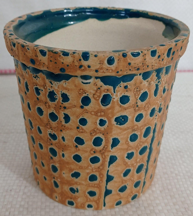 Fancy painted ceramic pot with peacock color dotted design