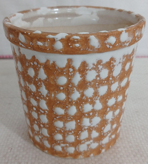 Round ceramic pot with fancy white dotted design