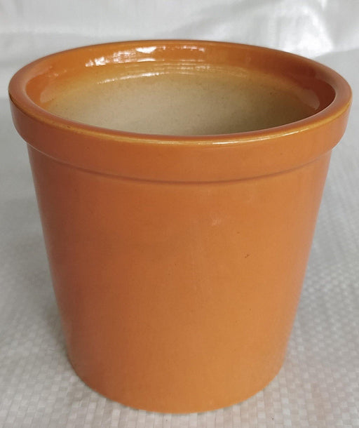 Contemporary round ceramic pots in glossy light orange finish