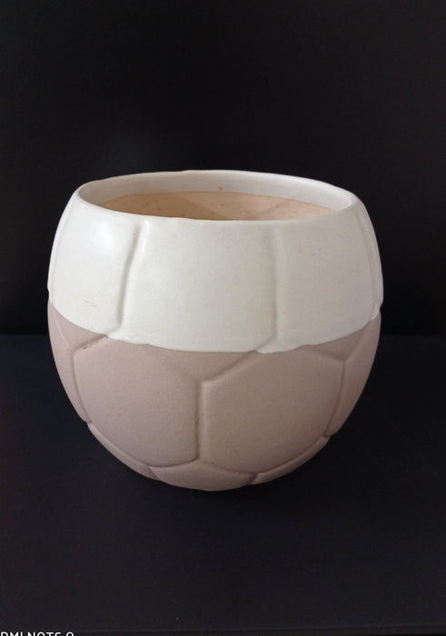 Football-shaped ceramic plant pot in white and light pink