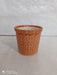 Contemporary round ceramic pot in orange with dotted design