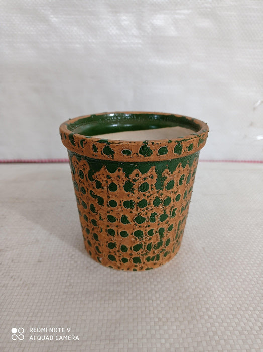 Contemporary round ceramic pot with glossy finish