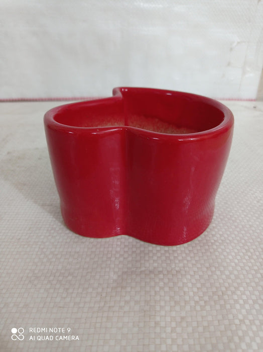 Vibrant red heart-shaped ceramic pots