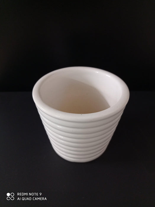 Contemporary white ceramic pots with ribbed design