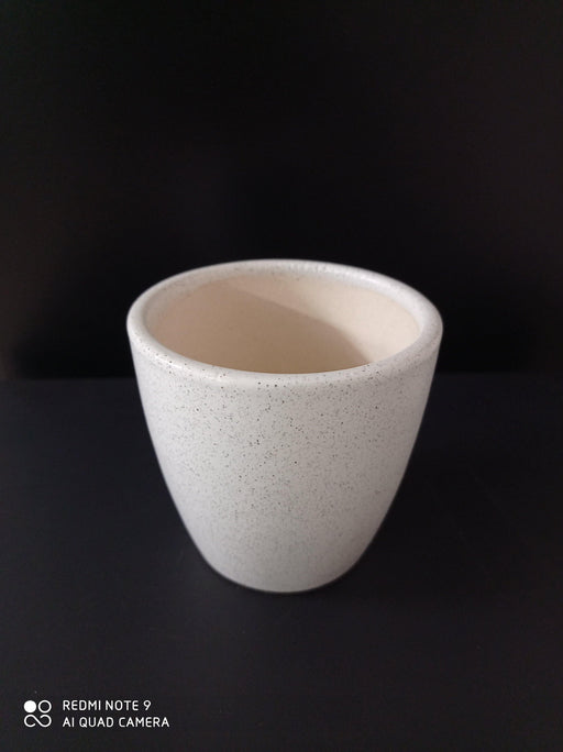 Small ceramic pot in white with dotted design