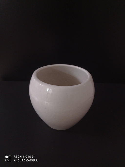 Round ceramic pot in minimalist design