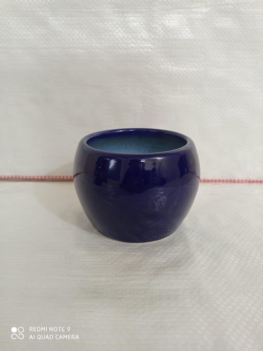 Blue handi-shaped ceramic plant pot