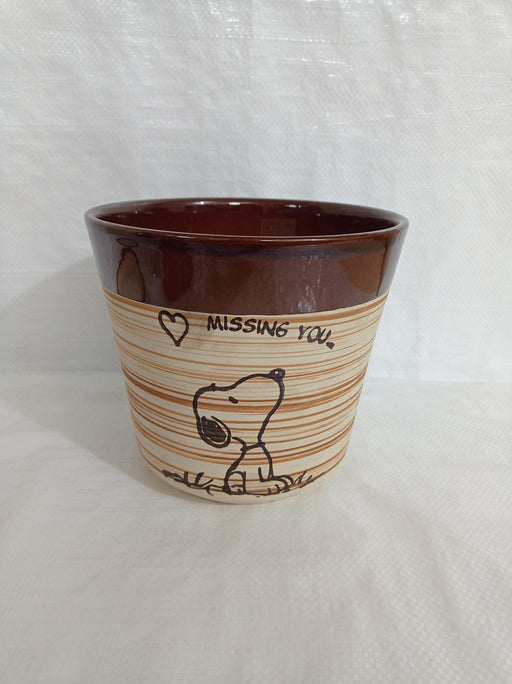 Fancy round ceramic plant pot with dog design