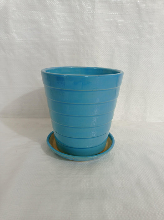 Medium sky blue ceramic plant pot with round design