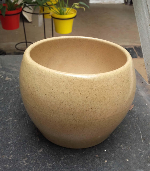 Sleek round ceramic plant pot in skinny color